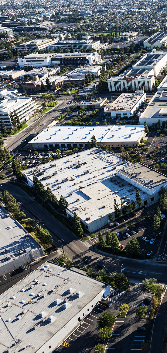 Aerial view of suburban commercial and industrial buildings in Los Angeles County, California.