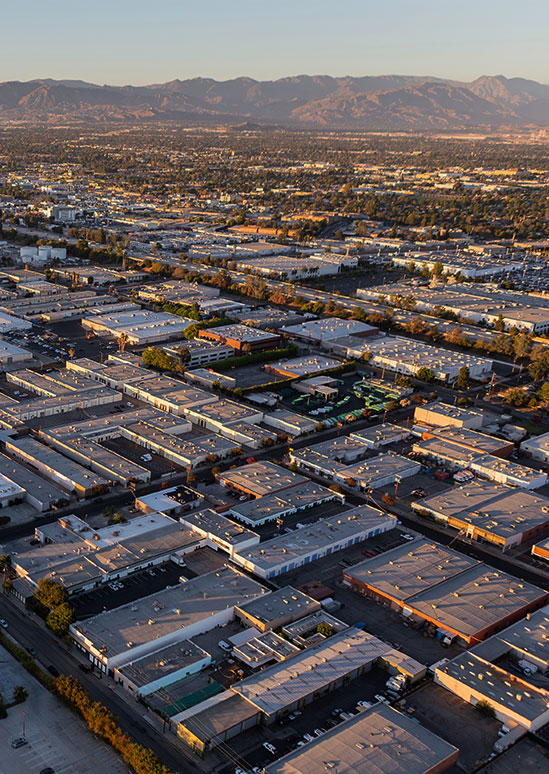 Late afternoon aerial view of industrial buildings in the Van Nuys area of Los Angeles, California